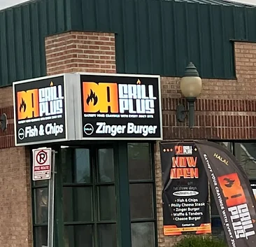 Da Grill Plus storefront on Queen Street North with its Fish & Chips and Zinger Burger signs