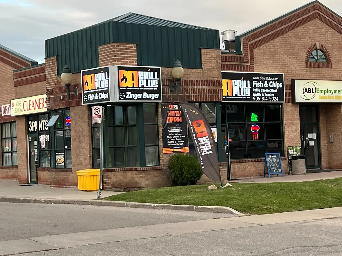 Da Grill Plus storefront on Queen Street North with its Fish & Chips and Zinger Burger signs